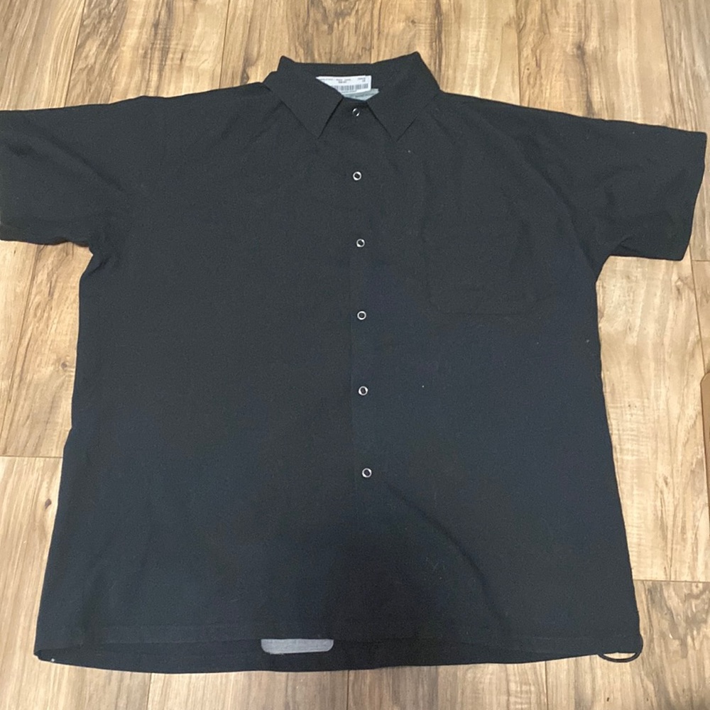 Black button down short sleeve shirt.